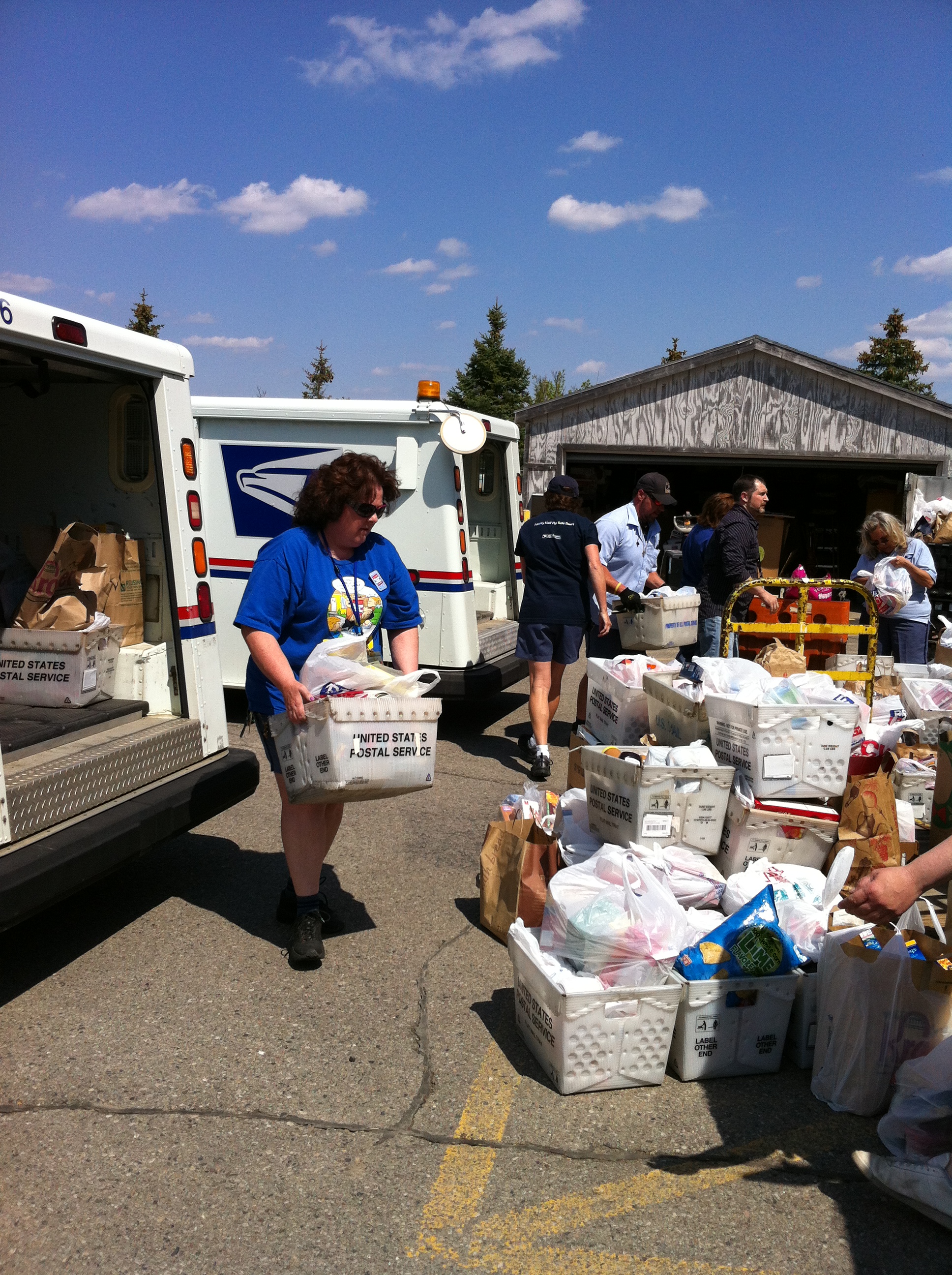 Volunteers sorting donated food at a previous Stamp Out Hunger food drive